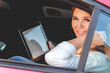 © perfectlab - Young, beautiful woman sitting in the back seat of a car with a tablet in hands