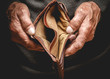 Leinwandbild Motiv Empty wallet in the hands of an elderly man. Poverty in retirement concept
