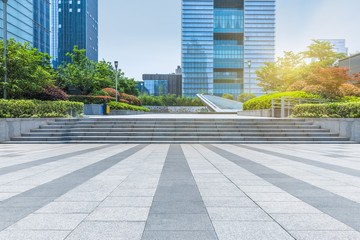 empty pavement front of modern architecture