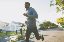 Man In Residential Area Jogging
