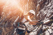 © XtravaganT - Single fit woman climbing side of mountain