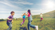 © Syda Productions - group of happy kids running outdoors