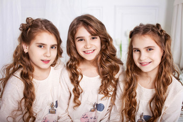 Portrait of three young charming sisters