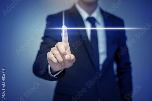 Fotografia, Obraz Close up of businessman touching digital screen with finger