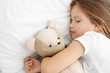 © Africa Studio - Cute little girl sleeping with teddy bear in bed