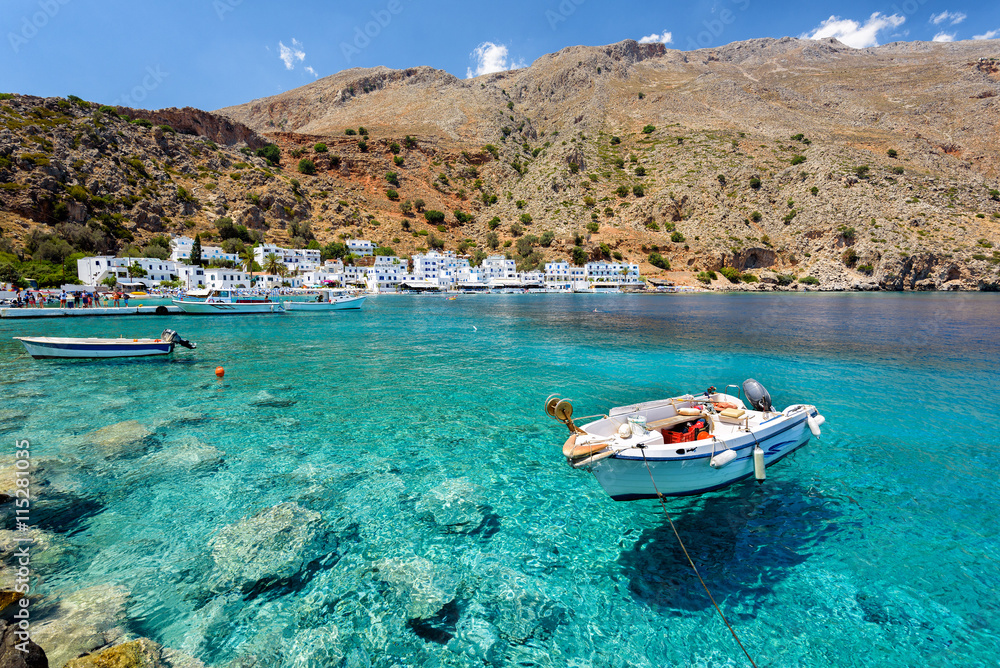 Obraz na płótnie Small motorboat at clear water bay of Loutro town on Crete island, Greece w salonie