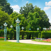 Summer Park With Beautiful Street Lights, Lawns And Hedges