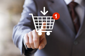 Businessman push web button shopping cart online buy