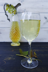 Wall Mural - White wine in glass and antique wine pitcher