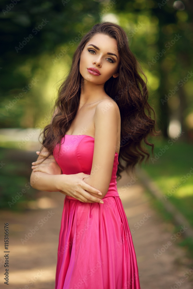 Beauty romantic girl outdoor. Pretty young model dressed in long evening  dress posing outdoors at path in the park. Full body Portrait with  beautiful bokeh Stock Photo | Adobe Stock