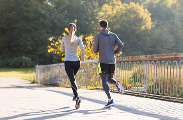  couple running or jogging outdoors
