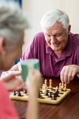 Senior couple playing chess