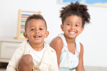 Two cute children having fun at home