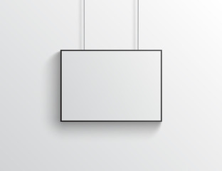 White horizontal poster with black frame mockup on grey wall