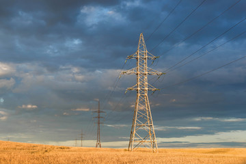 High voltage electric towers in the field. perspective view