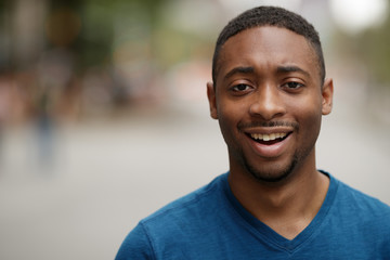 Canvas Print - Young black man in city shocked face portrait