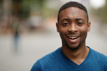 Canvas Print - Young black man in city shocked face portrait