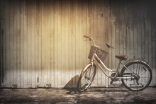 Vintage Bicycle On Vintage Wooden House Wall