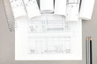 © Mr Twister - architectural hand-drawn sketch with blueprint rolls on desktop