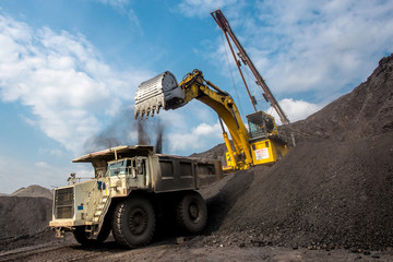 Wall Mural - Excavator at work in open pit