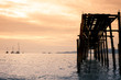 © RufflePhotos - sea and wood bridge with sunset in evening, with vintage tone and copy sppace