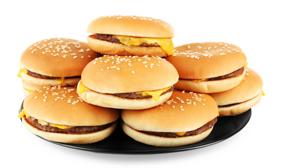 Sticker - Tasty cheeseburgers on plate, isolated on white