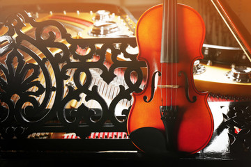 Sticker - Violin lying on piano, close up