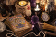 The tarot cards with crystal, candles and magic objects