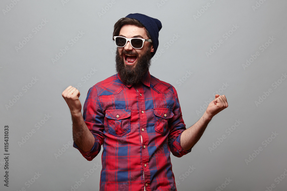 happy hipster man with beard exults - obrazy, fototapety, plakaty 
