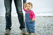 © scaliger - Baby girl and her father on the beach