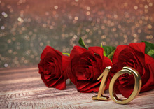 Birthday Concept With Red Roses On Wooden Desk. Tenth. 10th. 3D Render