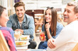 © Yakobchuk Olena - Happy friends having lunch in cafe