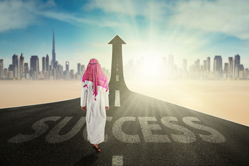 Wall Mural - Arabian man with arrow and Success word