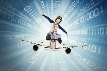 Boy riding airplane inside binary code