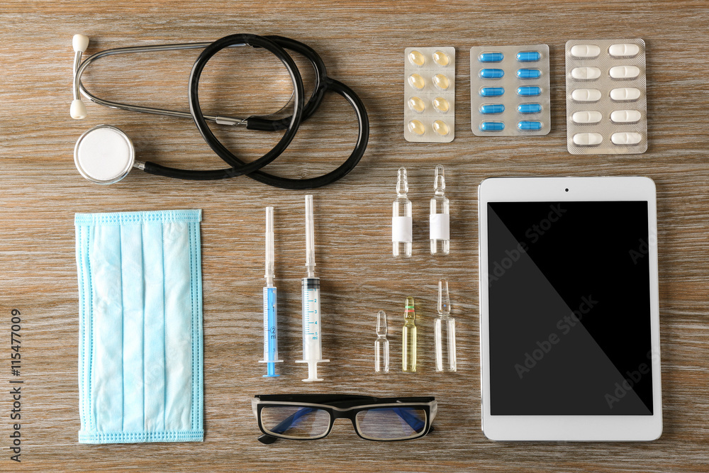 Doctor table with medical items. Flat lay