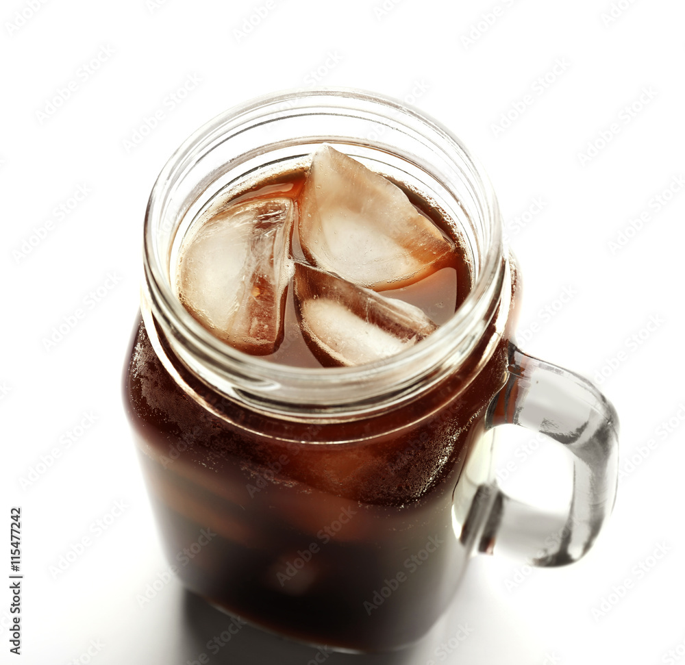 Iced coffee in glass jar on white background