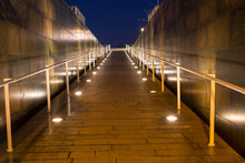 Lighted Walkway With A Fountain On Each Side