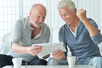 Poster - two senior men with newspaper