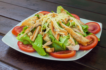 Chicken salad. Delicious salad with chicken, cheese and vegetabl