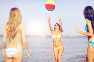 Poster - girls with ball on the beach