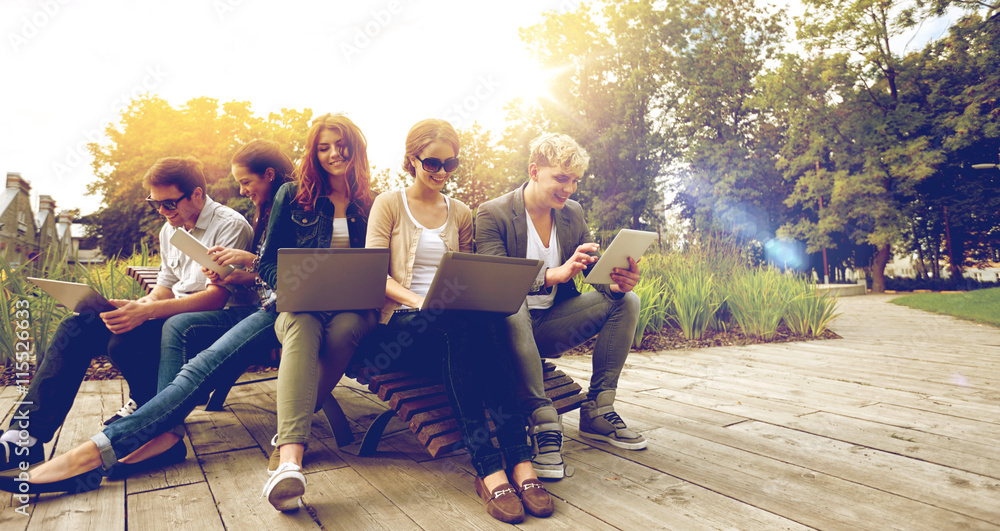 students or teenagers with laptop computers - obrazy, fototapety, plakaty 