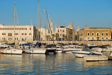 Wall Mural - The dock and the city of Trani at sunset in Apulia - Italy