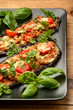Delicious appetizer -grilled eggplants baked with minced meat, tomatoes and cheese.