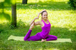 © sushytska - girl doing asana in park Yoga.