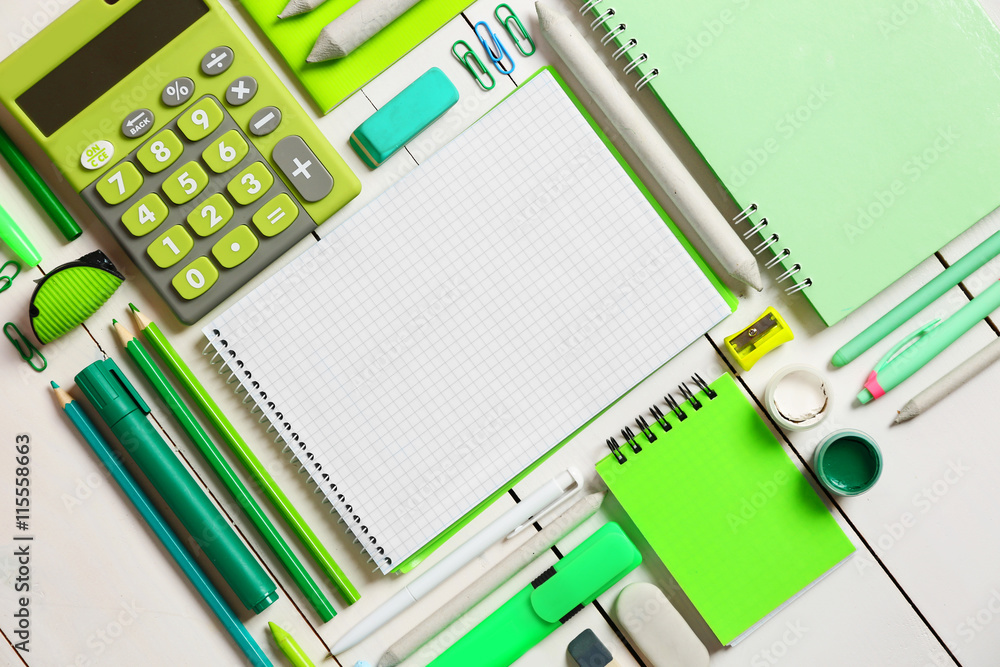 Flat lay of stationery on white wooden table background, copy space