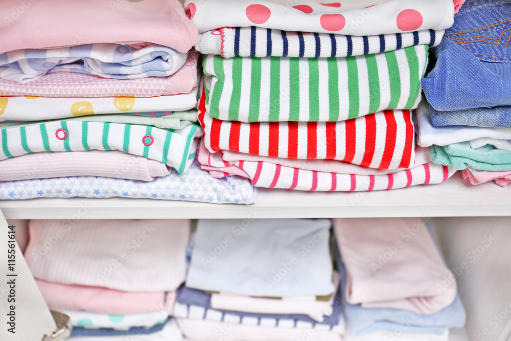 Clothes for kids on shelves