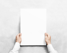 Hand Holding White Blank Poster Mockup, Isolated. Arm In Shirt Hold Clear Broadsheet Template Mock Up. Affiche Bill Surface Design. Broadside Pure Print Display Show. Sticking A3 Poster On The Wall.
