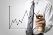 © violetkaipa - Businessman drawing graphics  growing graph