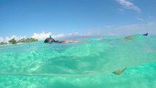 SLOW MOTION: Woman Swimming And Snorkeling In Blue Lagoon Ocean