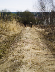 Vertical autumn russian road with two man background backdrop